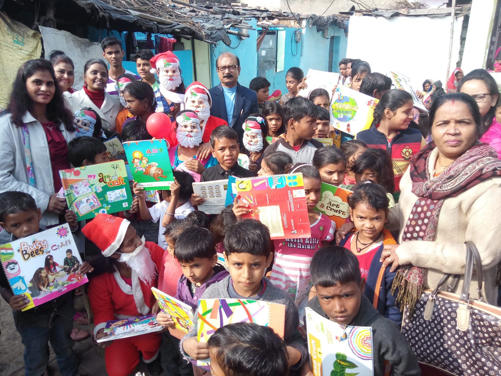 Happiness and gifts by Santa Claus in slum locality.